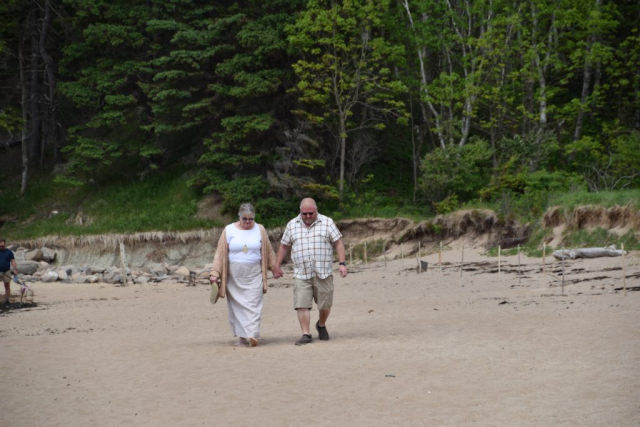 Married couple walking holding hands